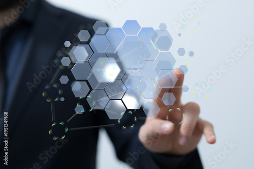 Close-up of a person interacting with a futuristic digital hexagon network. Perfect for technology and innovation concep