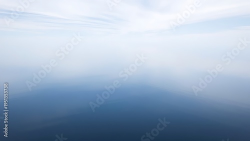 mistreat. A perfectly flat lake mirroring the sky with a seamless horizon. travel magazines, destination branding, designed for outdoor magazines and nature guides and travel destination branding.