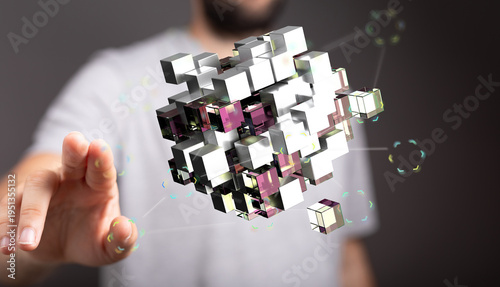 A close up of a hand interacting with a 3D rendered cube. Technology concept, internet, connection, abstract visualizati
