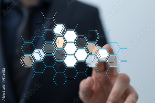 Hand touching digital hexag...