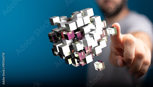 Abstract image showing a human finger touching digital cubes representing data, technology and future. Ideal for concept