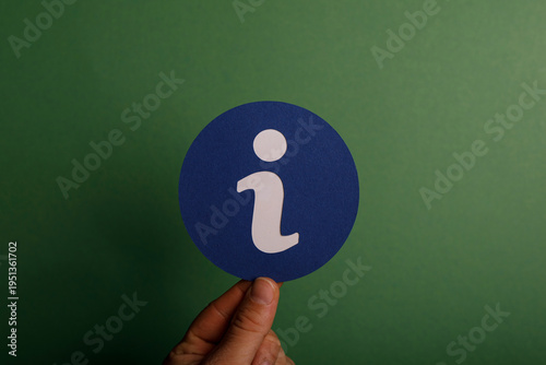 Hand holding an info symbol...