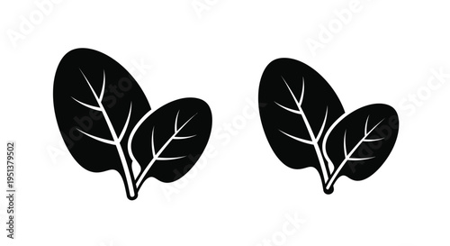 Two spinach leaves depicted in a stark minimalist black silhouette