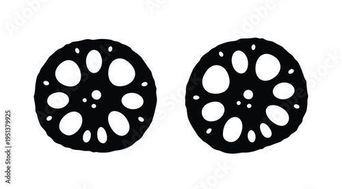 Two lotus root slices displayed against a white background a striking silhouette