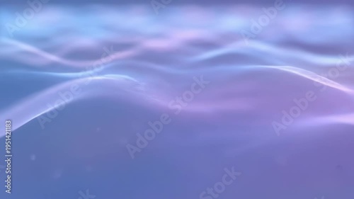 Soft, abstract waves flow across a gradient of blue to purple hues