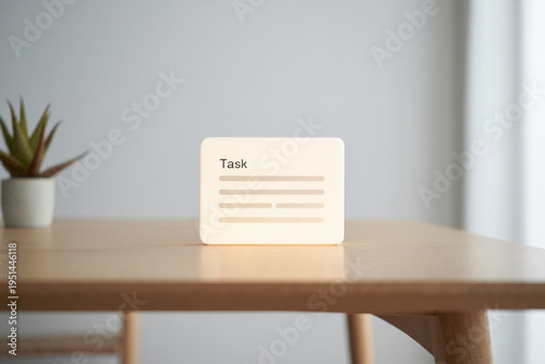 Task management concept, modern digital display with lines representing written text, minimal workspace.