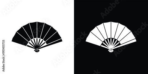 Black and white hand fan on white and black background