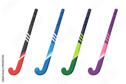 Collection of four colorful hockey sticks arranged in a row on a white background