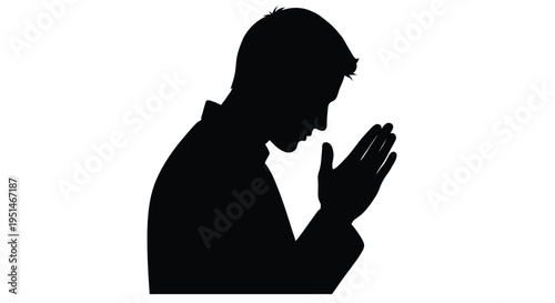 Man in prayerful pose with hands clasped a striking black silhouette