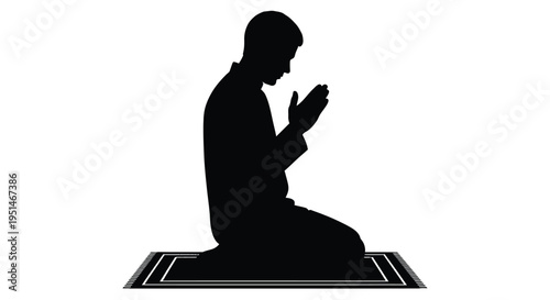 A man kneeling in prayer on a rug a striking black silhouette