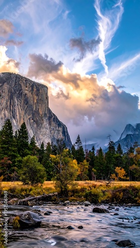 Majestic granite cliff face, river, and trees under a vibrant sky