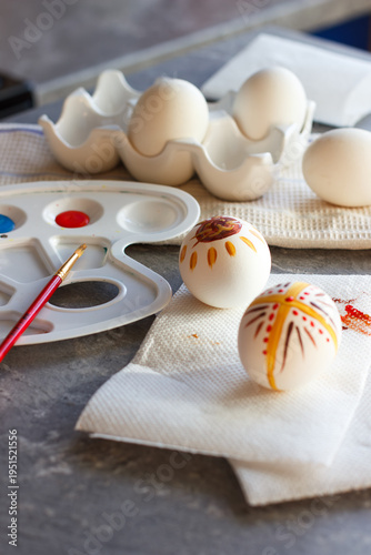 Preparing for Easter. Decorating eggs. Children's creativity. Painted eggs on the table