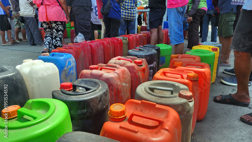 Fuel containers lined up waiting for gasoline refill. Oil Crisis, Stockpiling Oil, Fuel, Concept of fuel demand, shortage, energy supply and real-life situation