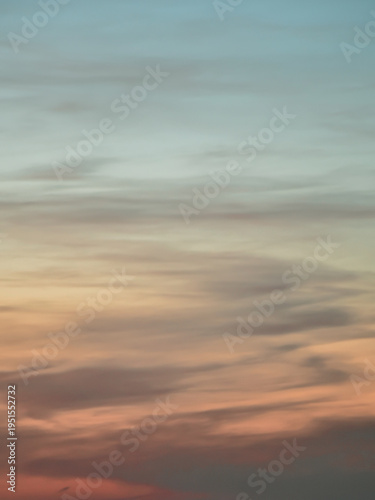 Pastel sunset sky with soft yellow and orange light gradients