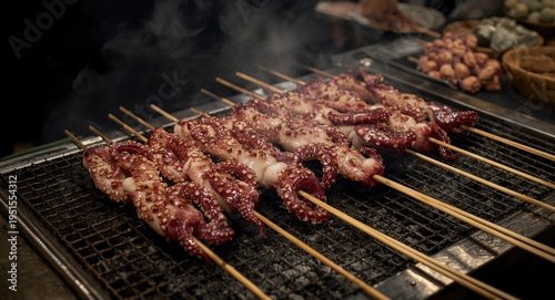 Wallpaper Mural Octopus skewers roasting over traditional charcoal BBQ in Japanese fresh market Torontodigital.ca