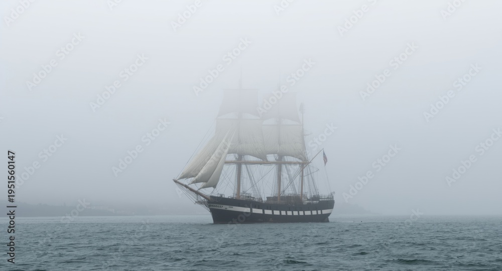 Fototapeta premium Old tall ship cruising through coastal fog