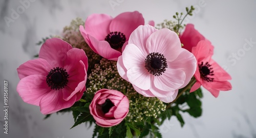 Pink Japanese anemone Koenigin Charlotte floral arrangement highlighting Anemone hybrida