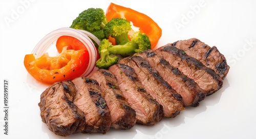 Sliced grilled steak accomp...