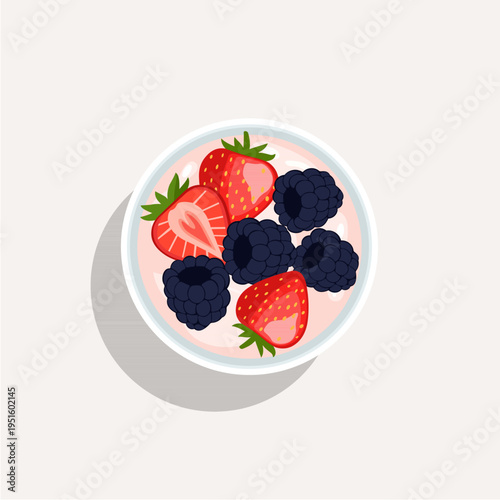 Top view of a healthy yogurt bowl with fresh strawberries, blueberries, and raspberries.