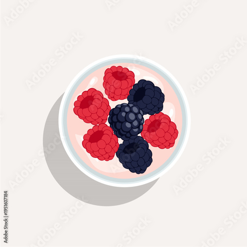 Top view of a healthy yogurt bowl with fresh strawberries, blueberries, and raspberries.