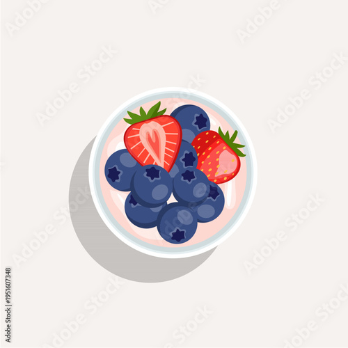 Top view of a healthy yogurt bowl with fresh strawberries, blueberries, and raspberries.