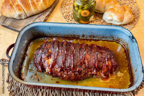 Wallpaper Mural Baked minced meat loaf with bacon in old pan, fresh bun and pickled cucumber. Torontodigital.ca