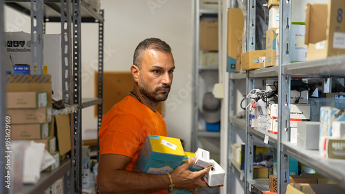 Wallpaper Mural Logistics staff choosing and packing spare parts for timely delivery to clients Torontodigital.ca