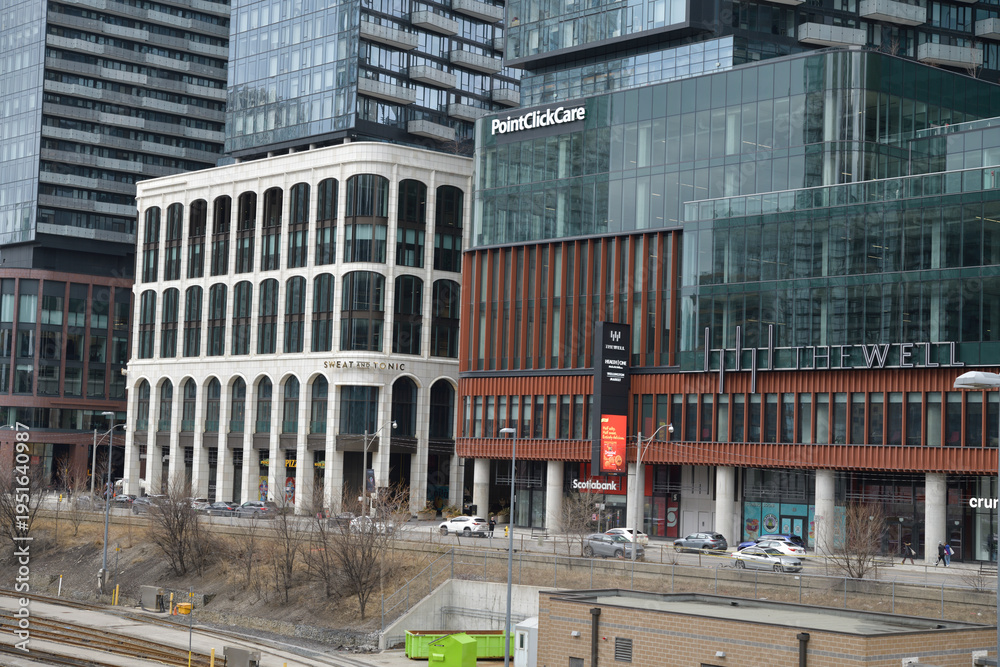 Naklejka premium facades and signage at The Well a mixed used shopping business and condominium complex at 486 Front St W, Toronto