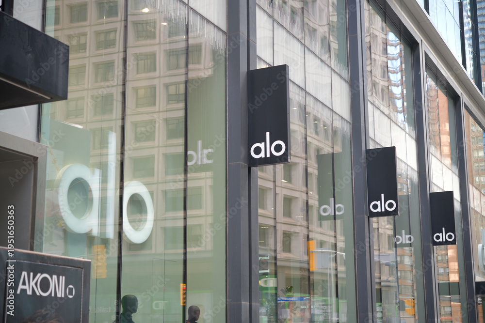 Fototapeta premium exterior building facade and sign of ALO, a clothing store, located at 60 Bloor St W, Toronto