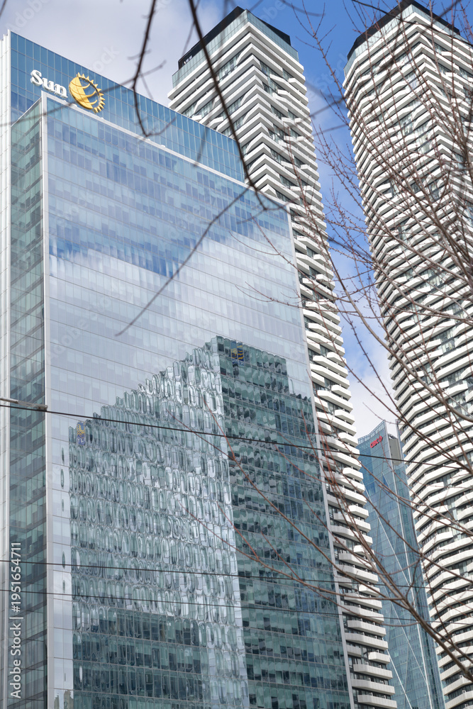 Fototapeta premium exterior building reflection and sign of Sun Life Financial (One York Street), Harbour Plaza Residences, and RBC WaterPark Place (abstracted in the windows), Toronto