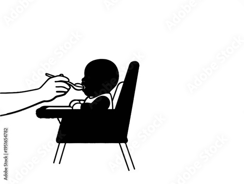 Hand feeds baby sitting in high chair with spoon