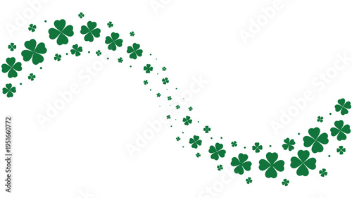 A scattering of vibrant green clover leaves against a white background
