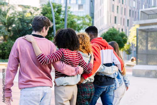 Konstfotografi Group of diverse young people with arms around each other walking away from the