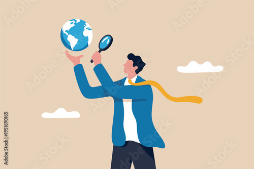 A business professional examining a small globe with a magnifying glass for global market research
