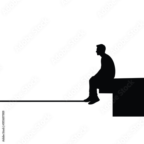Black silhouette of a man sitting on a black rectangular
