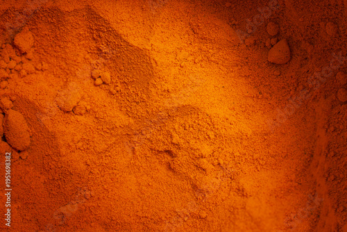 Turmeric powder natural spices as background.