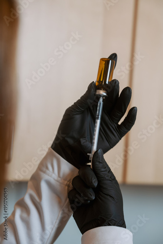 Woman preparing an injection with a small syringe