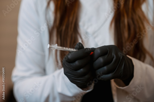 Woman holding a syringe