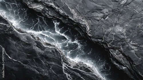 Dramatic Abstract Dark Rock Texture with Luminous Veins, Ideal for Backgrounds and Design Elements