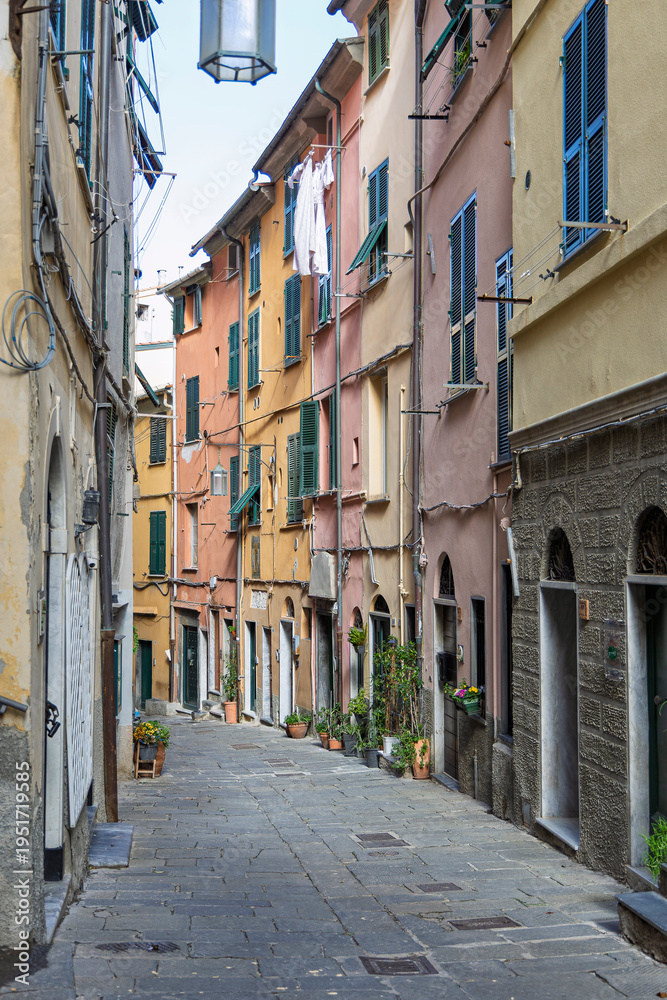 Naklejka premium Alley of a old hamlet. Characteristic main little alley of the medieval hamlet named Portovenere. Liguria, Italy. 