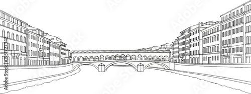 Ornate arched bridge spans a canal lined with buildings