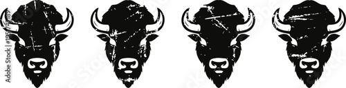 four black silhouettes of buffalo heads with strong horns and distinct facial features