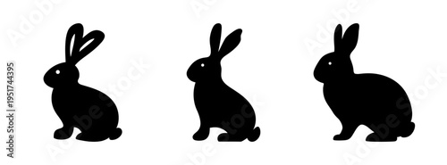 Three black rabbit silhouettes vector drawing for easter bunny and animal designs and clip art