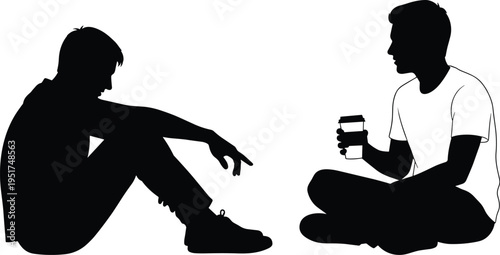 Two young men friends sitting on floor together talking having conversation silhouette with one person holding coffee cup on white background
