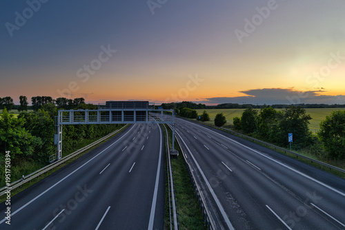 Empty German Autobahn Highway at Sunset with Gantry Sign - Leer - Transport - Landschaft - Autofrei - Highway - Road - Asphalt - Lines - Street - Route - Traffic - Travel - Ecology - Trail - Motorway