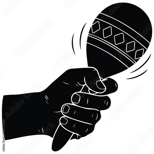 Hand holding and shaking a maraca instrument in motion