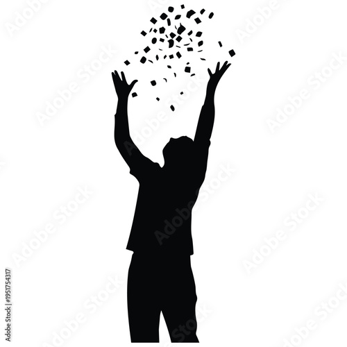 Silhouette of a man throwing papers in the air in celebration