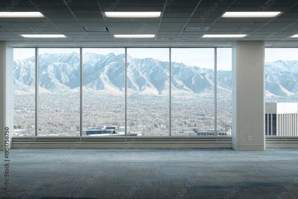 Fototapeta premium Modern Office Space with Expansive Windows and Mountain View: A Bright, Empty Interior