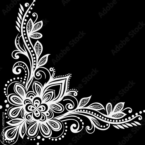 Elegant floral corner design in black and white with swirling details