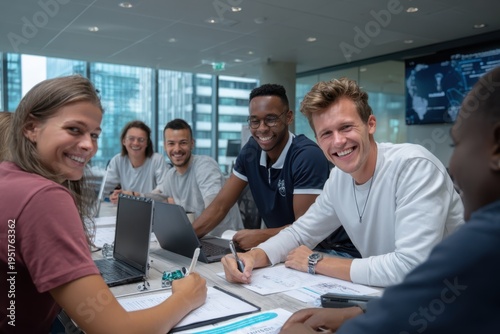 Smiling diverse professionals collaborate during a productive meeting in a modern office environment
